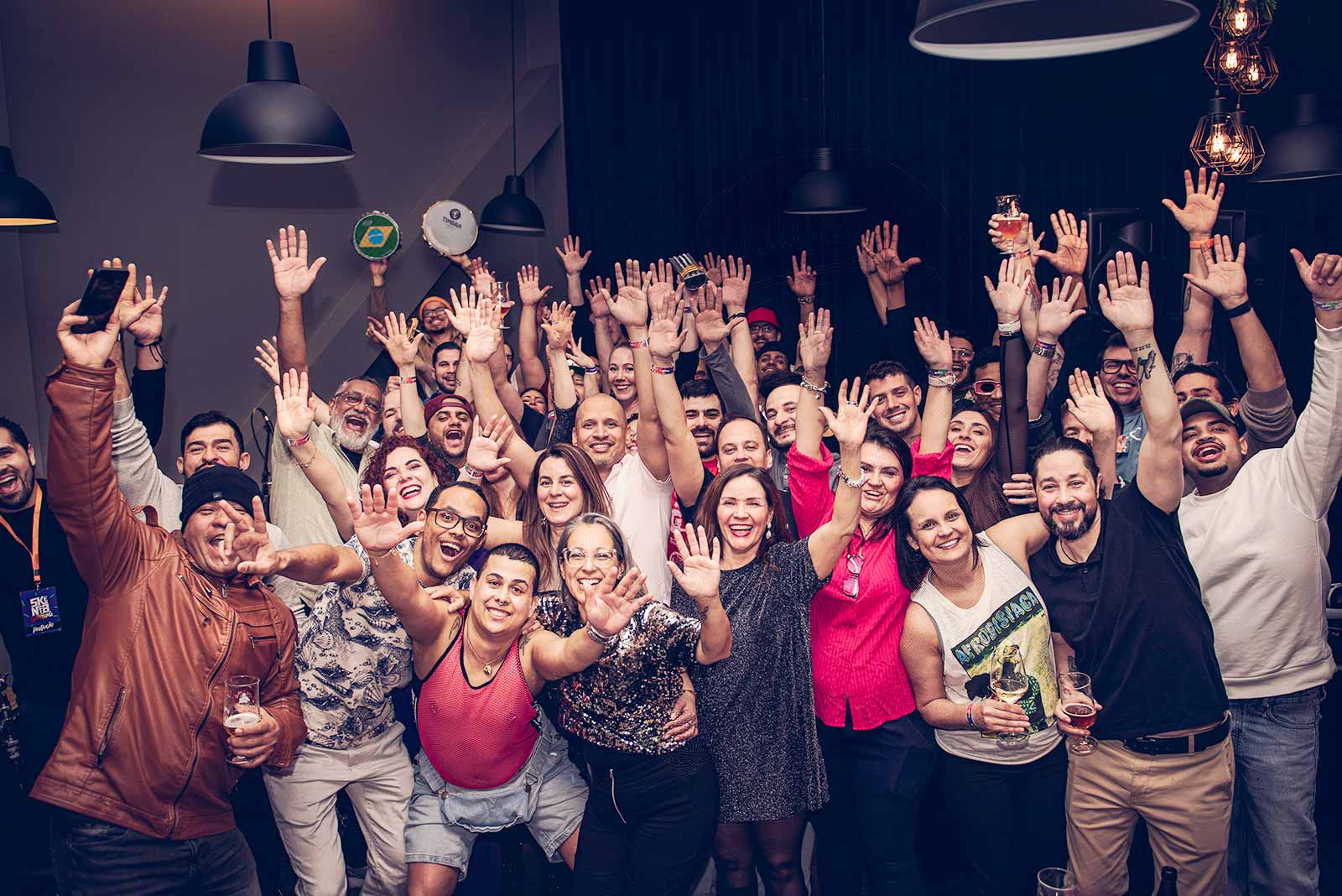Crowd raising their hands at the closing